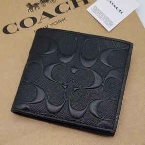 新品 COACH 折り財布 エンボスシグネチャー
