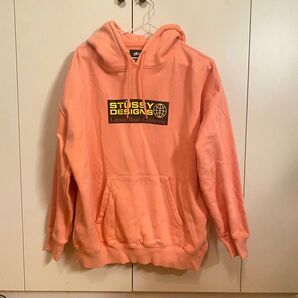 ストゥーシー ピンクフードパーカー オレンジ