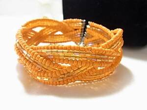  origin . color. orange color. beads using design. wonderful bangle *++